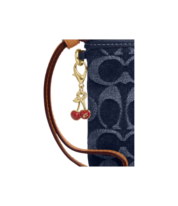 Muñequera coach un cierre denim cerezas